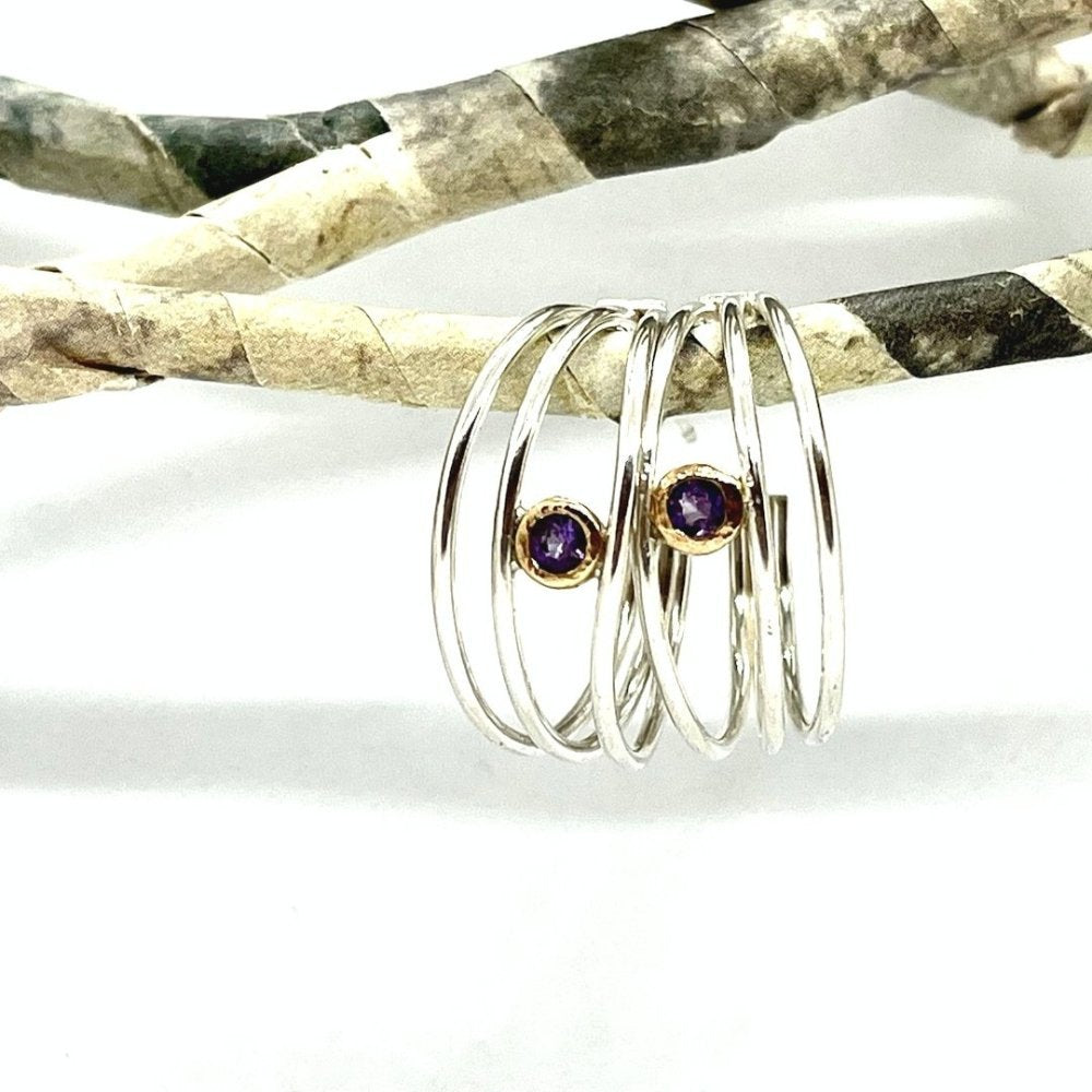 silver 3 wire hoop earrings with 14k gold and amethyst faceted stone. silver and gold together mixed metal.