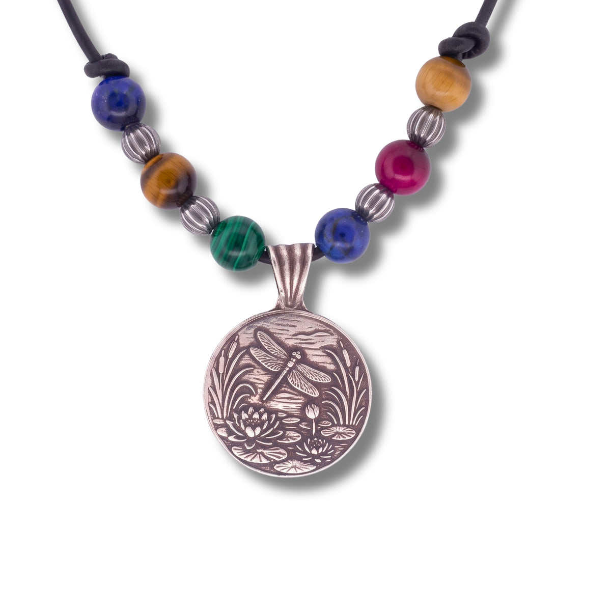 A beaded necklace with a round silver-toned pendant featuring an engraved dragonfly and lotus design. The necklace includes a black cord, silver spacer beads, and colorful stone beads in blue, green, magenta, brown, and gold.
