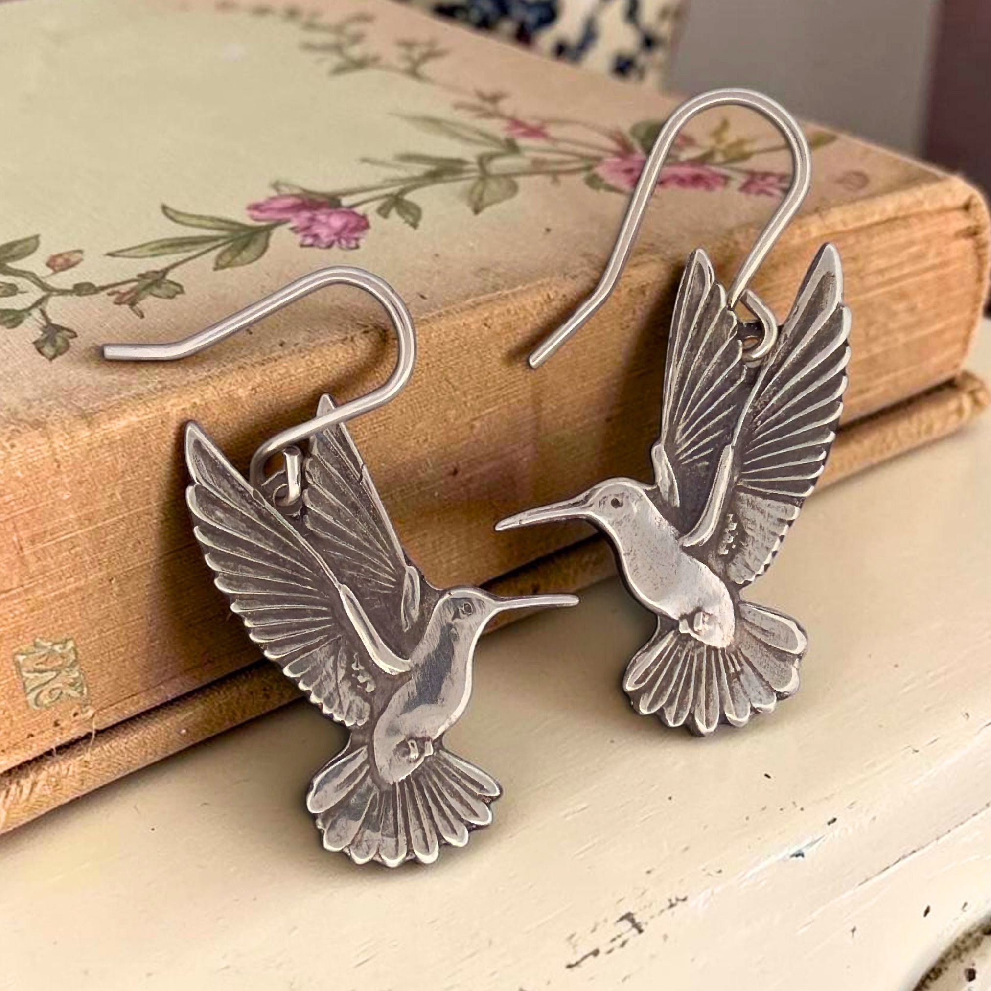 Handmade Sterling Silver Hummingbird Earrings Dangle Style Bird Lover Gift Perfect Nature Enthusiast Present Fine Silver Charms Detailed Wing Feather Engravings Antiqued Finish Lightweight Comfortable Daily Wear Jewelry Artisan Crafted